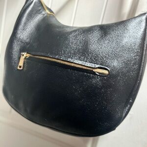 Gently used black leather Coach hand bag